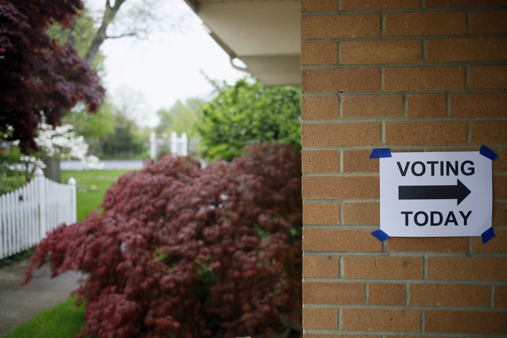 A Voting Sign On A Wall
